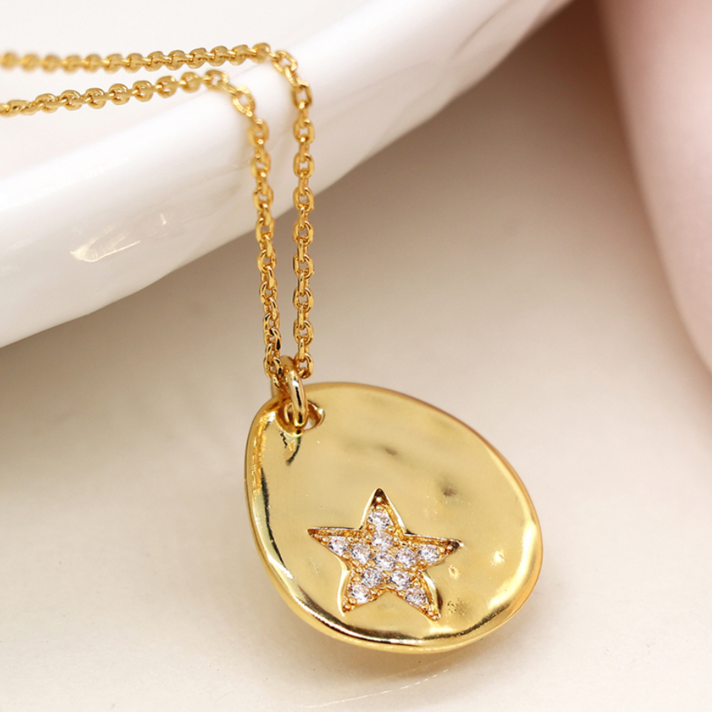 POM Faux gold organic polished teardrop necklace with crystal star imprint
