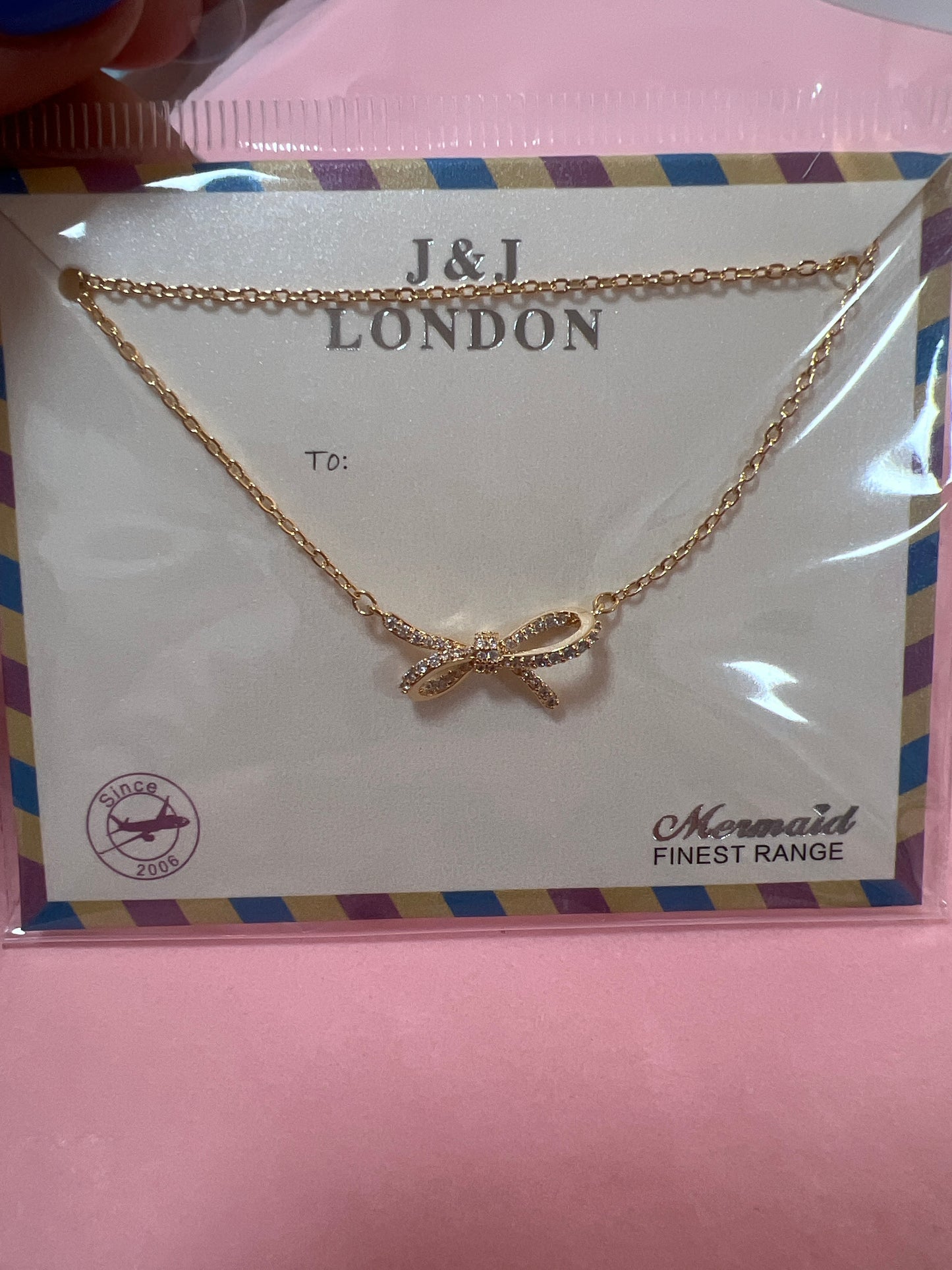 Gold Plated Bow Necklace with Cubic Zirconia Detail