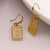 POM Golden Embossed Amulet Earrings With Crystals