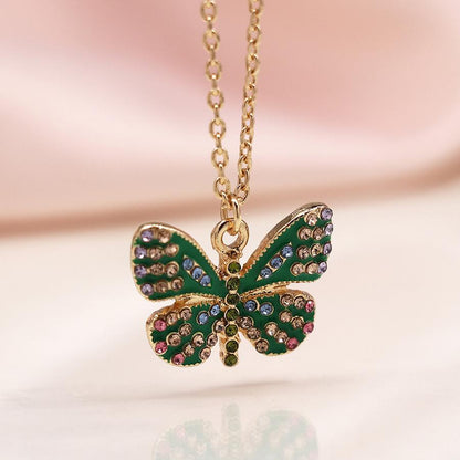 POM Faux gold plated green enamel and crystal butterfly necklace